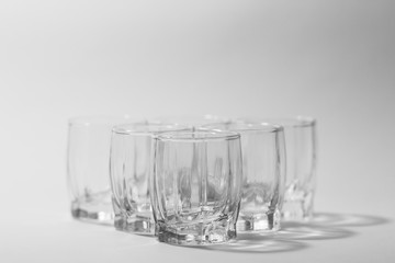 transparent small glasses on a white background