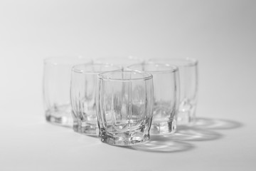 transparent small glasses on a white background