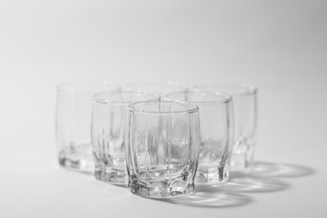 transparent small glasses on a white background