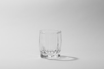 transparent small glasses on a white background