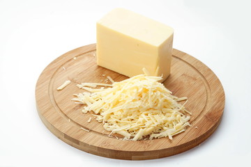 Cheese on a cutting Board isolated on a light background
