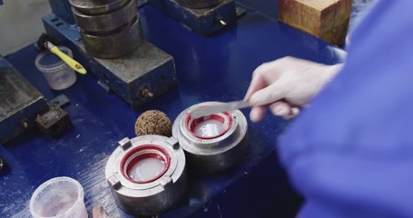 Mixed race man working in factory - Powered by Adobe