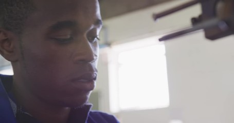 Close up view of worker working in factory - Powered by Adobe