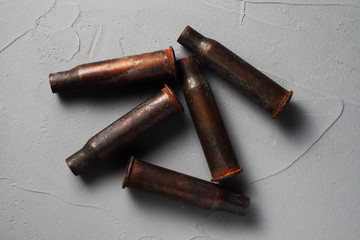 cartridge cases on a concrete background