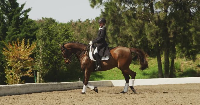 Caucasian woman riding her horse