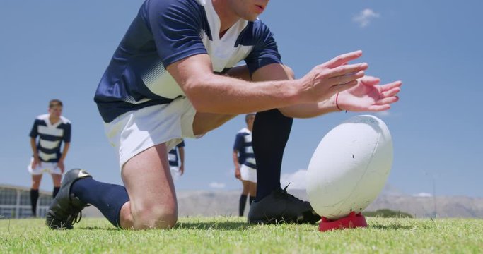 Rugby players playing on field