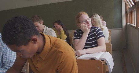 Caucasian girl thoughtful in high school class