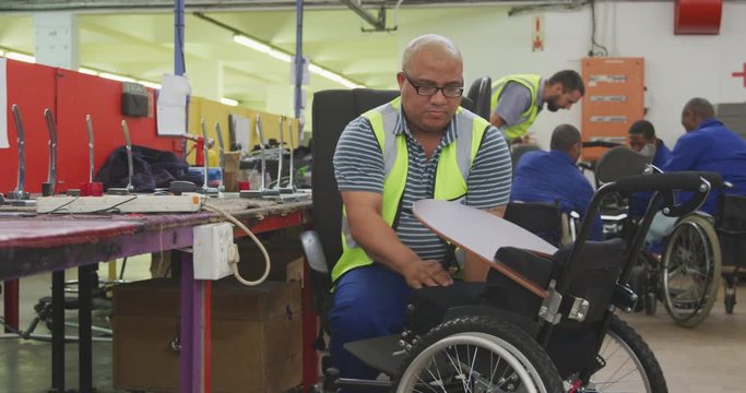 Disabled man installing his wheelchair