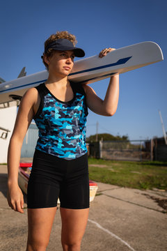 Female rowing team training on a river