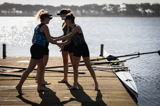 Female rowing team training on a river