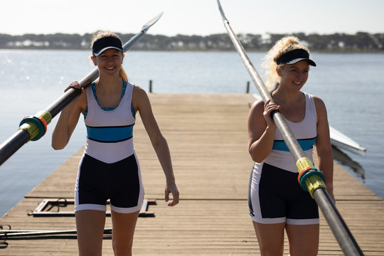 Female rowing team training on a river