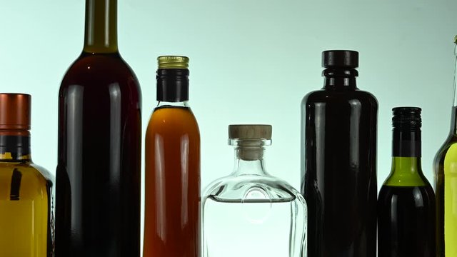 different alcohol stands in a row on a white background
