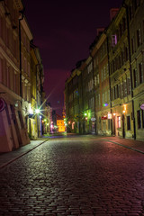 Fototapeta na wymiar Streets of Warsaw Old Town by the night. Piwna street.