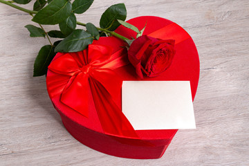 Greeting card mock up with red rose and gift boxe