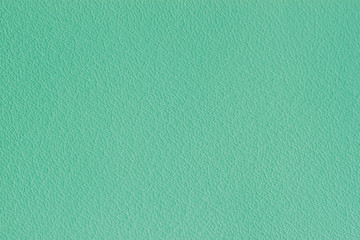 Texture of genuine grainy leather of light mint green color for modern background, copy space