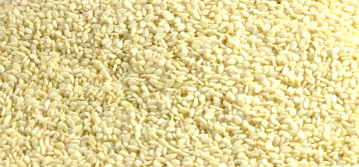 Sesame seeds close-up. Natural healthy food for vegetarians. Background from sesame seeds.