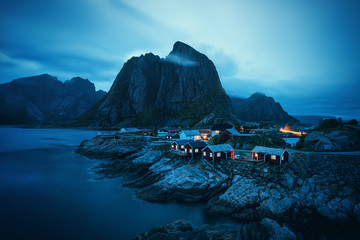 Houses in the Lofoten islands bay. Natural landscape in blue hour - 327040561