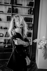 close up a blonde girl with closed in black jacket 