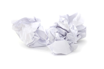 compressed white sheets of paper on a white background.