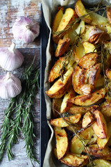Delicious rustic baked potato with rosemary and garlic.