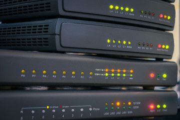 Color indication on the interfaces of office telephone routers. Communication equipment for voice Internet connection. Network gateways for IP telephony work in the server room. Technology concept