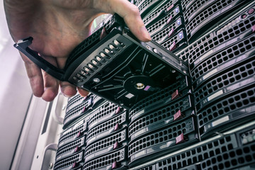 Replacing a module in a powerful server hardware. Cloud storage technology concept. Hosting...