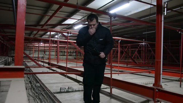 security guard patrol check the night waerhouse