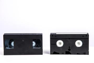 VHS video cassette isolated on white, retro video technology , analog magnetic tape 