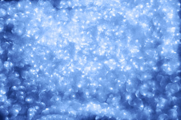 Fototapeta na wymiar Abstract blurred blue sparkle bakground.