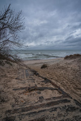 sandy beach of the sea on a cold autumn evening