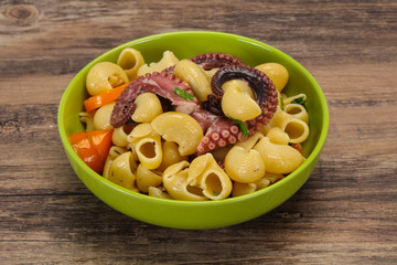 Pasta with octopus and yellow tomatoes