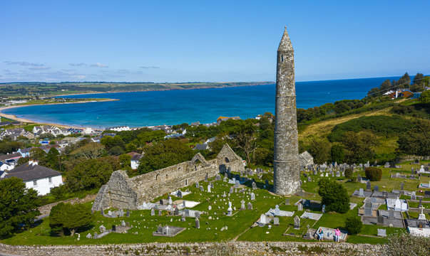 Aerial view of Ardmore Round Tower, Built in the 12h century, the tower stand tall over looking the coastal village of Ardmore.