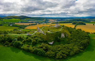 The Rock of Dunamase is a rocky outcrop in County Laois the ruins of Dunamase Castle, a defensive stronghold dating from the early Hiberno-Norman period.