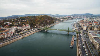 Obraz premium Budapest,Hungary - Aerial skyline view of Petofi Bridge .Boat Ride on the River Danube. Cloudy day