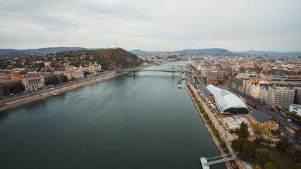 Drone view of Petofi Bridge .Boat  Ride on the River Danube. Cloudy day. Budapest, Hungary