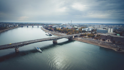 Aerial skyline view of Petofi Bridge .Boat  Ride on the River Danube. Cloudy day