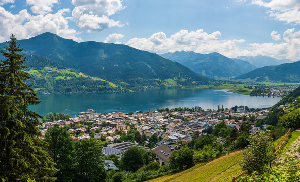 Panorama of the city of Zell am See with Zeller Lake in summer. Nature panoramic view of mountain, meadows and Tirol Alps in Salzburger Land, Austria.