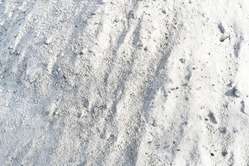 Snow white sand. Background of white fine sand.