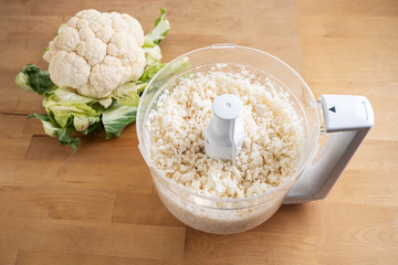 cauliflower shredded in a food processor for healthy low carb pizza crust or as vegetable rice...