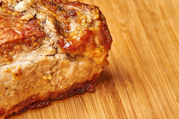 baked meat cut into pieces close up photo