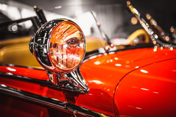 Vintage headlight of an old car - head light with an incandescent lamp