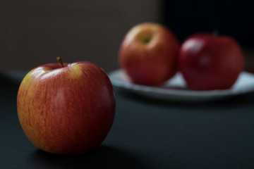 red apple close-up on a dark background