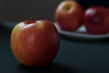 red apple close-up on a dark background