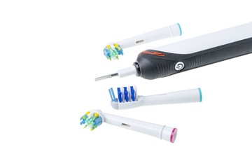 Three kinds of head and toothbrush close up view isolated. Health care concept.