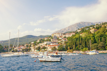 Fototapeta na wymiar Beautiful summer Mediterranean landscape. Montenegro, Adriatic Sea, Bay of Kotor. View of Herceg Novi city from sea