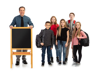 Male Teacher With Students And Empty Easel Blackboard For Message