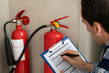 Professional Checking A Fire Extinguisher