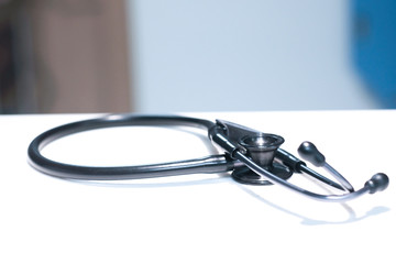 Black stethoscope in hospital ward