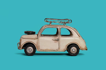 retro toy car on blue background