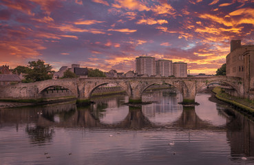 The Historic Old Bridge at Ayr in Scotland and a Spectacular Sunset over the town Centre.